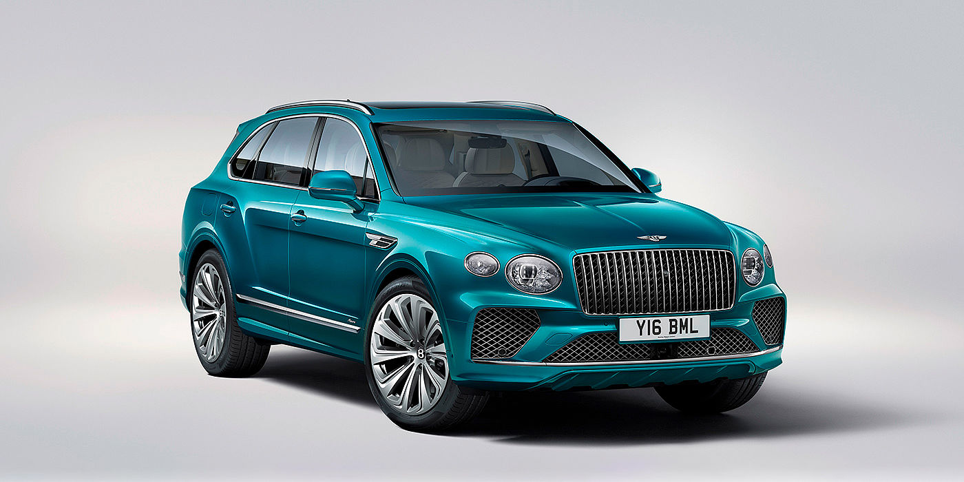Gohm Sportwagen GmbH | Bentley Singen Bentley Bentayga Azure front three-quarter view, featuring a fluted chrome grille with a matrix lower grille and chrome accents in Topaz blue paint.