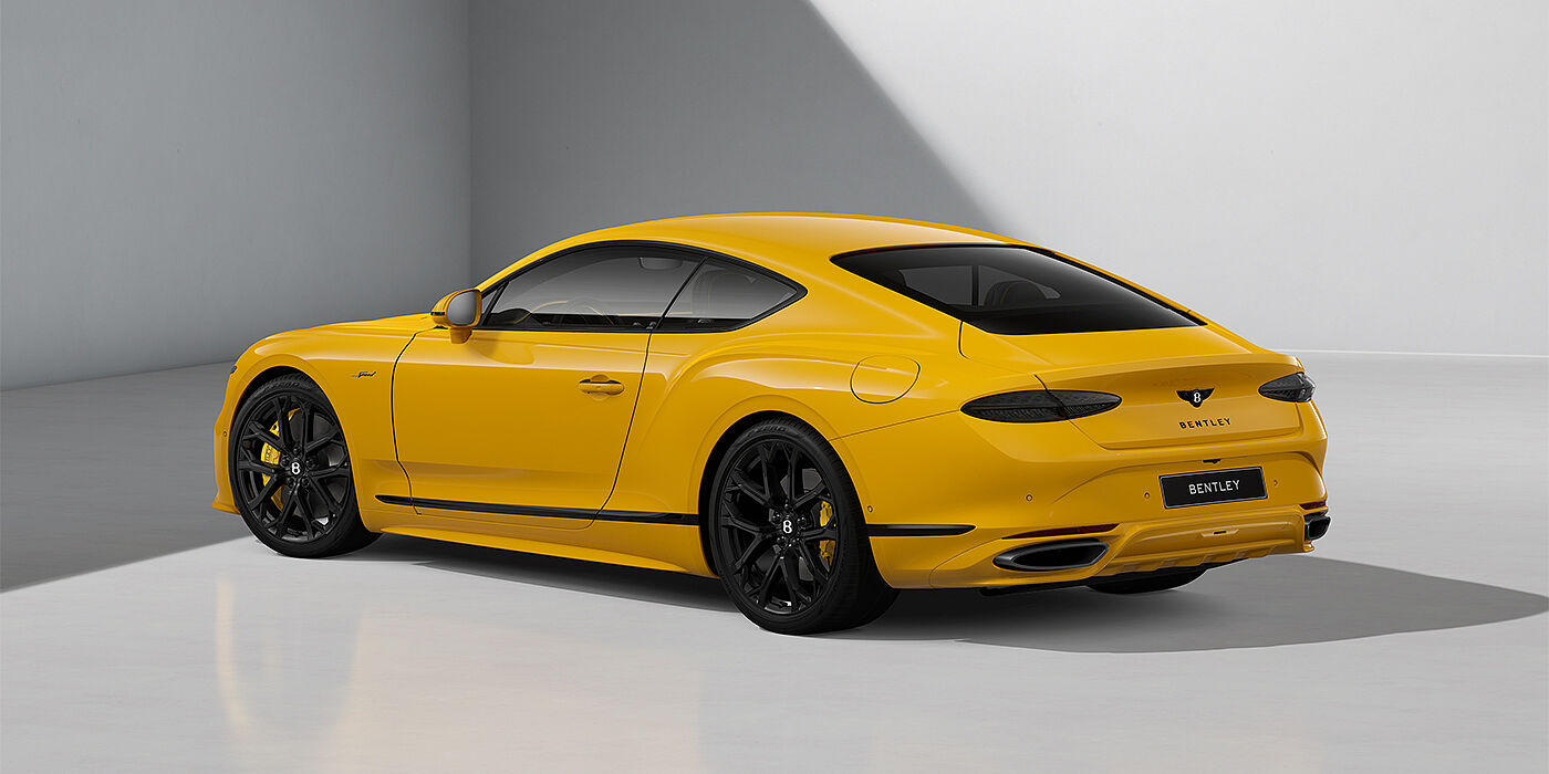 Gohm Sportwagen GmbH | Bentley Singen Bentley Continental GT Speed coupe in Monaco Yellow paint and 22" Ten spoke sport wheels - rear 3/4