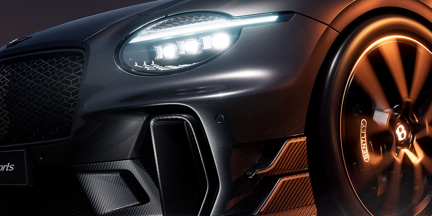 Gohm Sportwagen GmbH | Bentley Singen Bentley Supersports front three quarter headlamp and lower grille detail in "Nightfall" design theme with Anthracite paint, Camel accents and Camel and Beluga Black striping