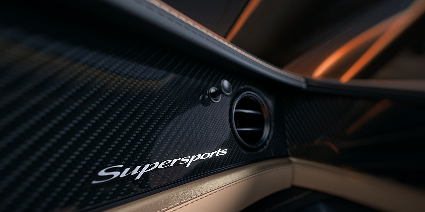 Gohm Sportwagen GmbH | Bentley Singen Bentley Supersports front interior high gloss black carbon fibre veneer detail with Supersports badge