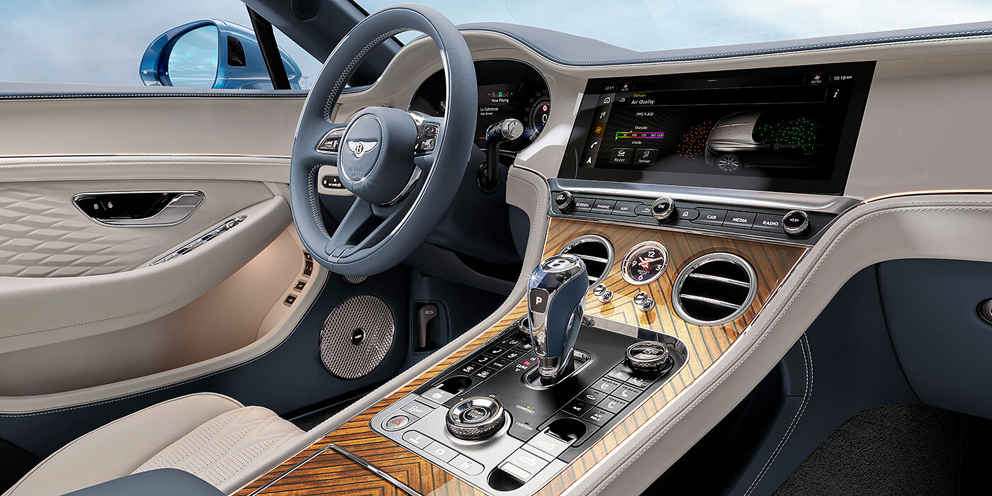 Gohm Sportwagen GmbH | Bentley Singen New Bentley Continental GTC Azure convertible interior front cabin view with Linen and Brunel hides and Piano Linen by Mulliner veneer featuring centre console and centre MMI screen
