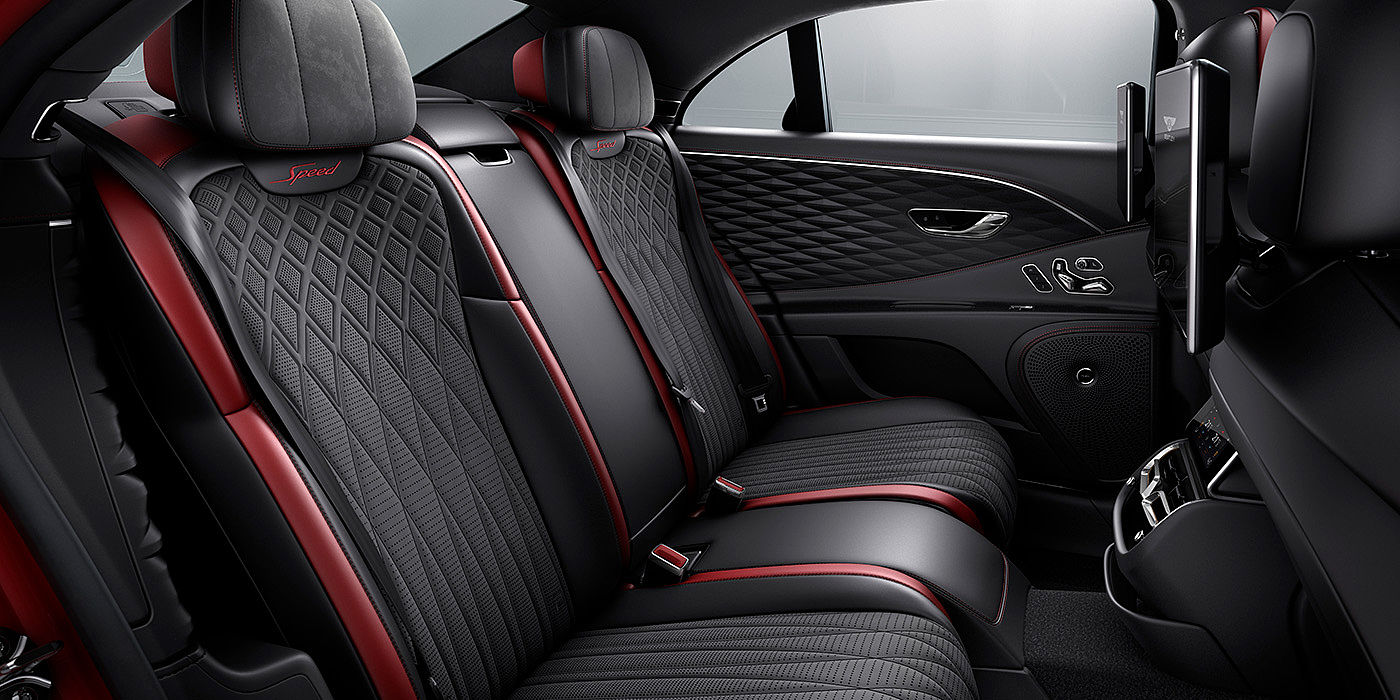 Gohm Sportwagen GmbH | Bentley Singen Bentley Flying Spur Speed sedan rear interior in Beluga black and Cricket Ball red hide