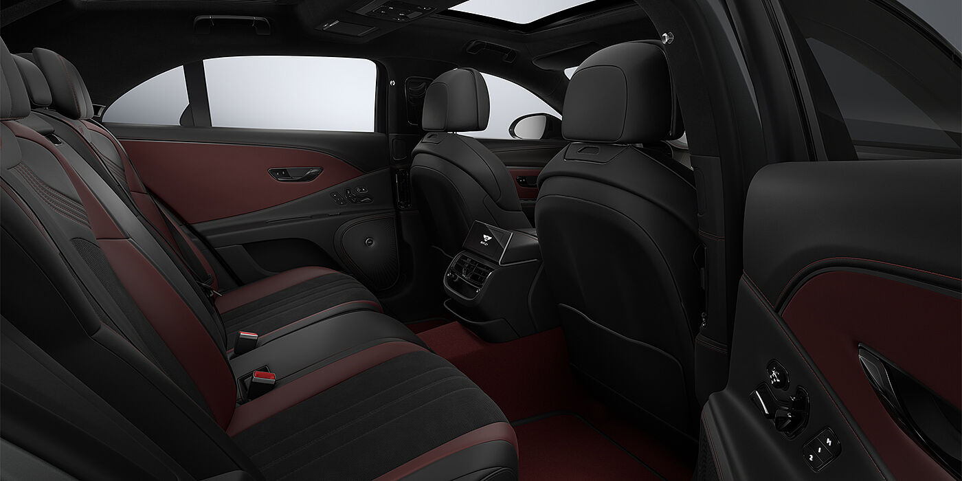 Gohm Sportwagen GmbH | Bentley Singen New Bentley Flying Spur S sedan rear interior in Cricket Ball red and Beluga black hides with High Gloss Carbon Fibre veneer