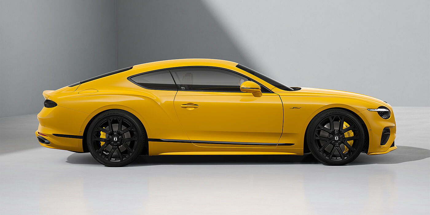 Gohm Sportwagen GmbH | Bentley Singen Bentley Continental GT Speed coupe in Monaco Yellow paint and 22" Ten spoke sport wheels - profile
