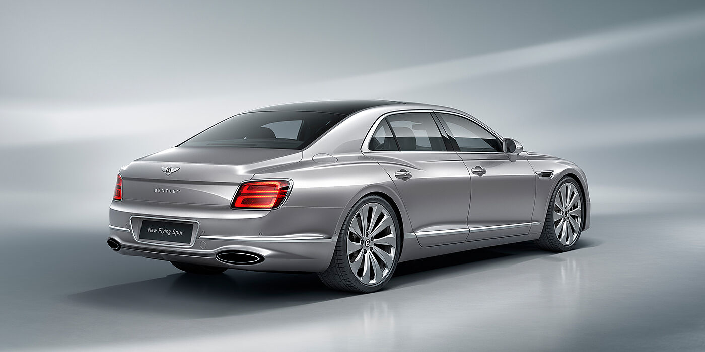 Gohm Sportwagen GmbH | Bentley Singen New Bentley Flying Spur sedan rear view in Silverlake paint with ten spoke wheels and chrome matrix grille