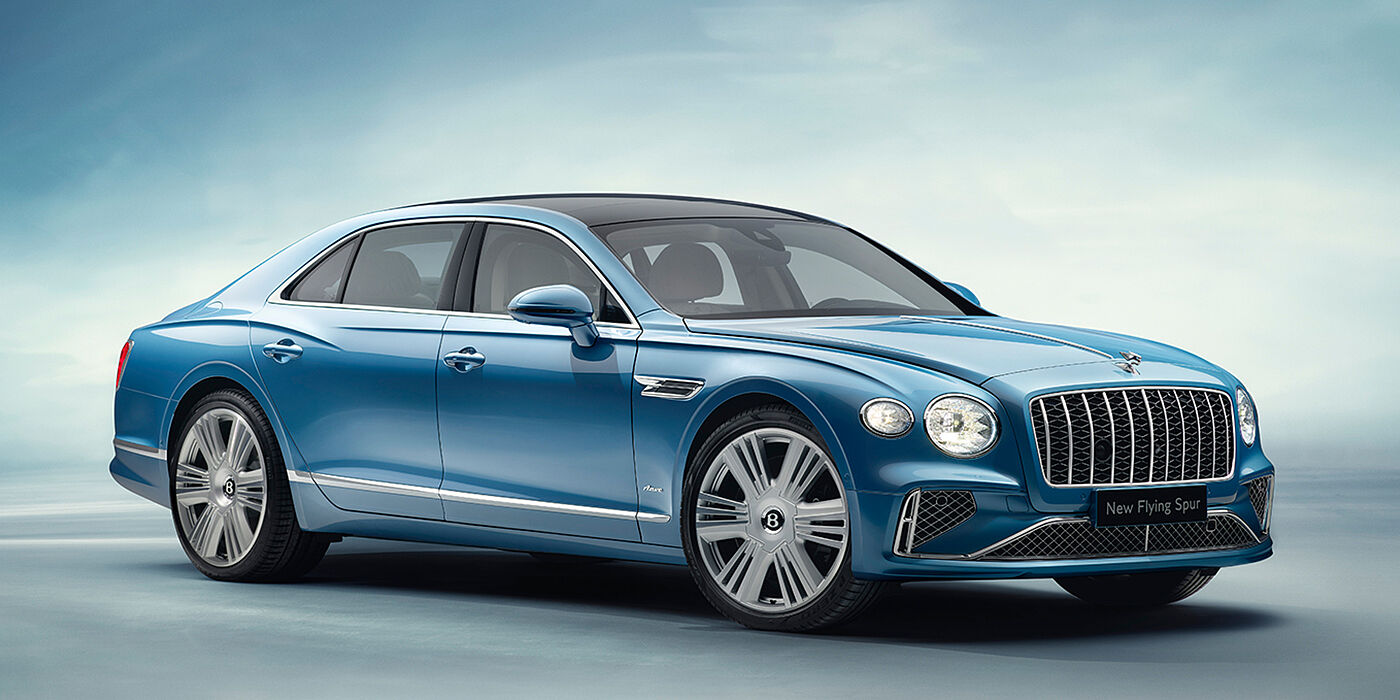 Gohm Sportwagen GmbH | Bentley Singen New Bentley Flying Spur Azure sedan front view in Light windsor blue by Mulliner paint with 22 inch Azure wheels and chrome exterior details