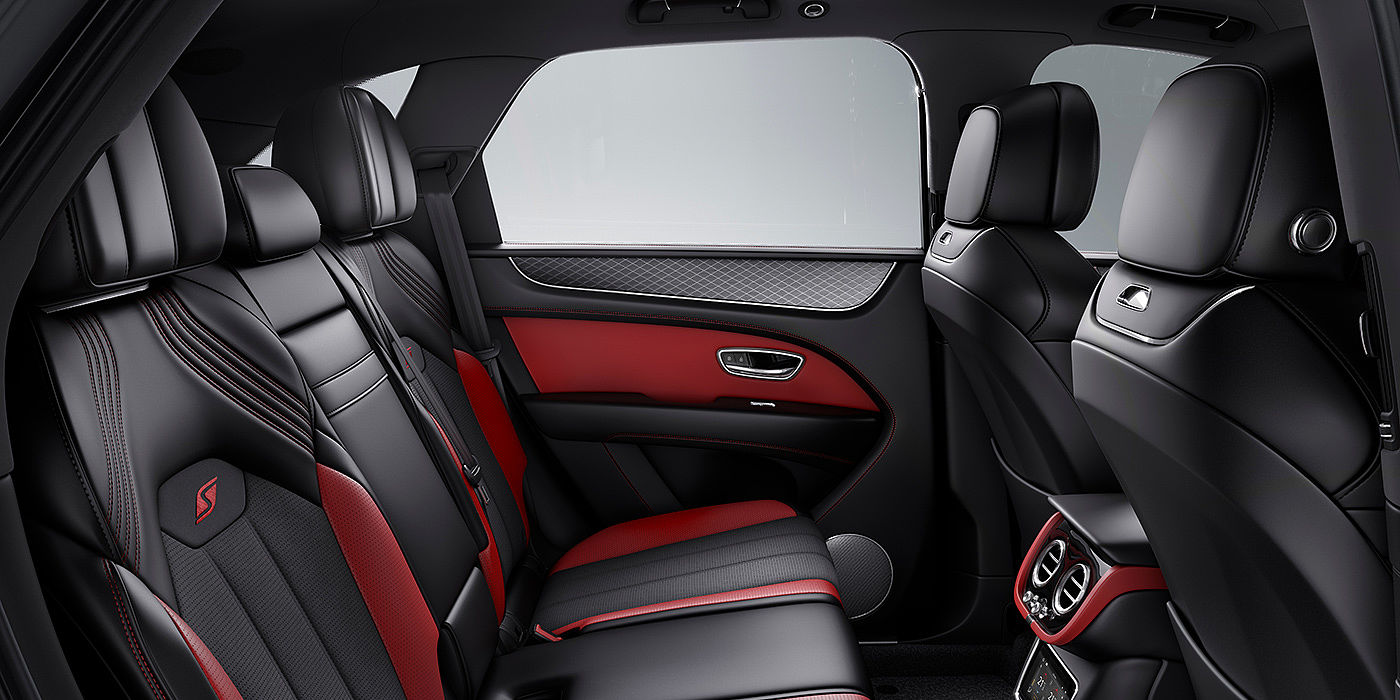 Gohm Sportwagen GmbH | Bentley Singen Bentey Bentayga S interior view for rear passengers with Beluga black and Hotspur red coloured hide.