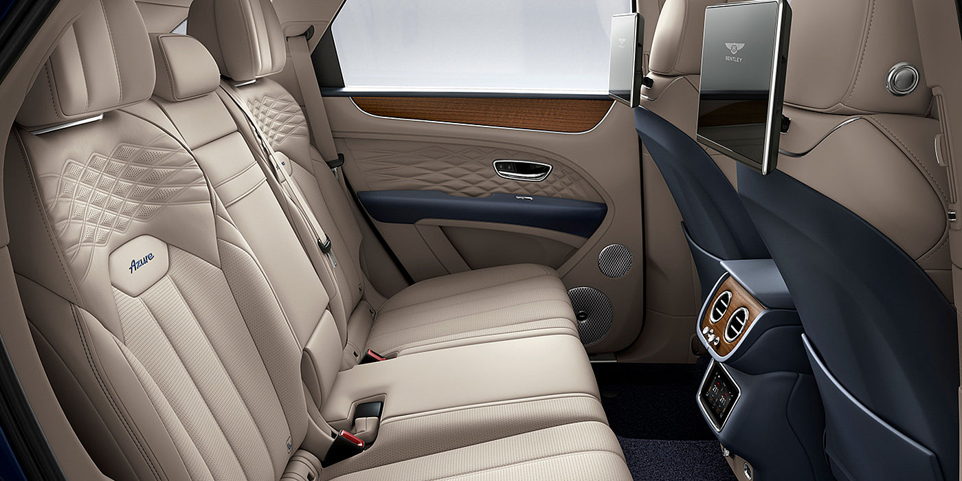 Gohm Sportwagen GmbH | Bentley Singen Bentey Bentayga Azure interior view for rear passengers with Portland hide and Rear Seat Entertainment. 