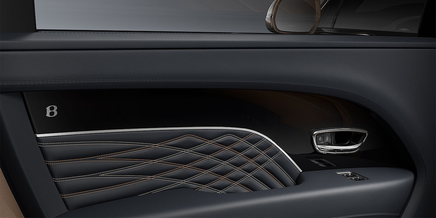 Gohm Sportwagen GmbH | Bentley Singen Bentley Bentayga EWB Mulliner SUV door interior detail in Brunel hide and Grand Black veneer with Mulliner contrast stitching