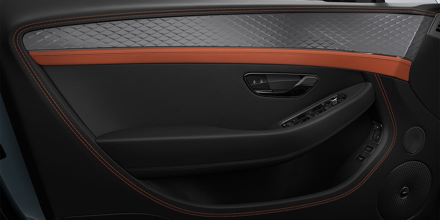 Gohm Sportwagen GmbH | Bentley Singen Bentley Continental GT coupe door interior detail in Newmarket Tan and Beluga black hides with Diamond Brushed Dark Tint Aluminium venee