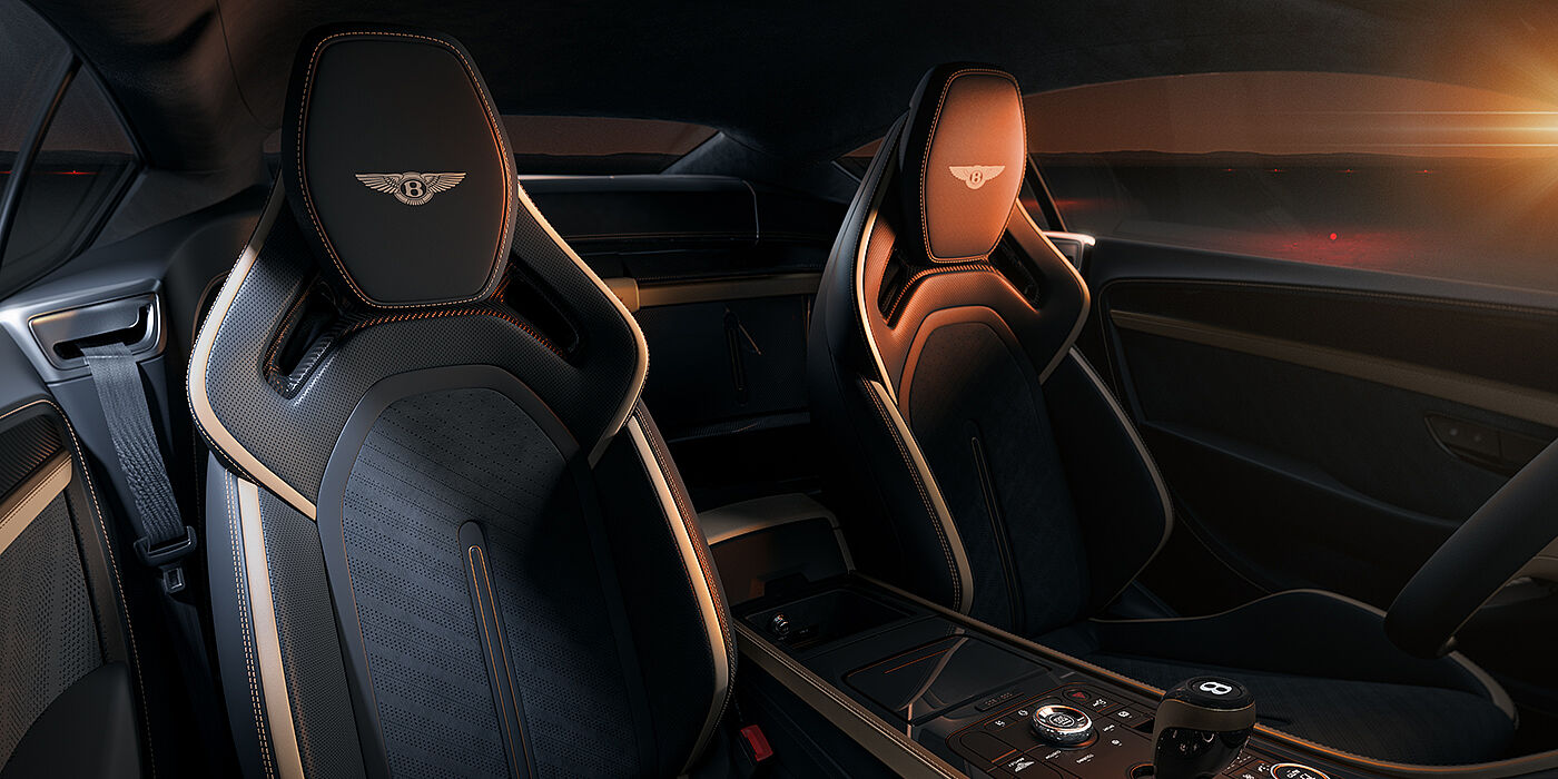 Gohm Sportwagen GmbH | Bentley Singen Bentley Supersports rear interior with Supersports seats in Camel and Beluga black hides hide and high gloss carbon fibre veneer