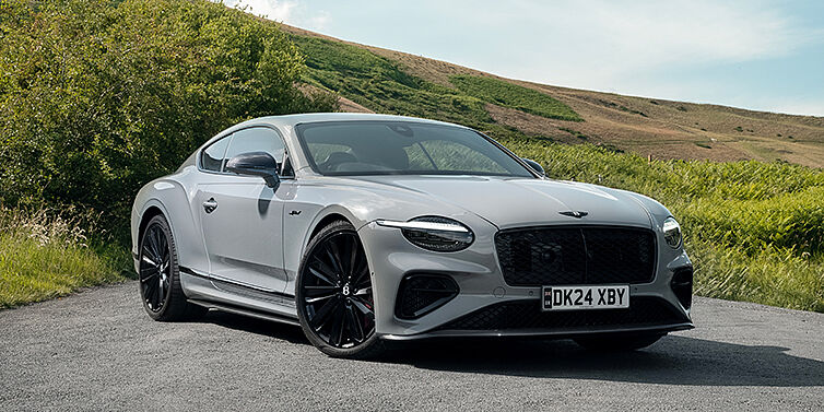Gohm Sportwagen GmbH | Bentley Singen Bentley Continental GT front three quarter with Carbon Fibre Specification parked on road.