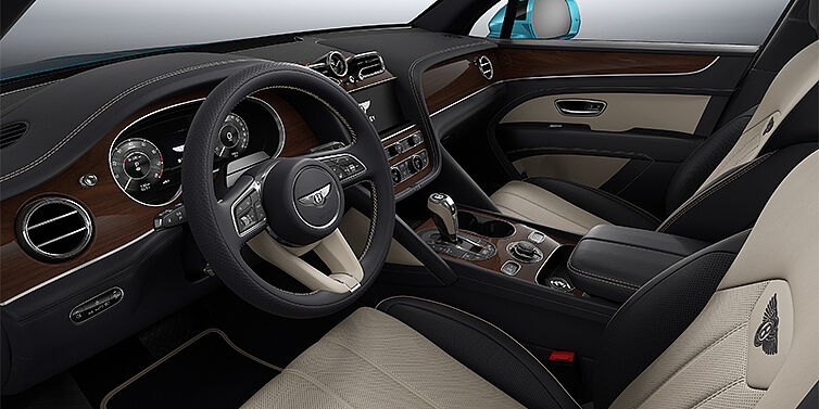 Gohm Sportwagen GmbH | Bentley Singen Bentley Bentayga EWB SUV front interior in Portland and Imperial Blue hides with Crown Cut Walnut veneer