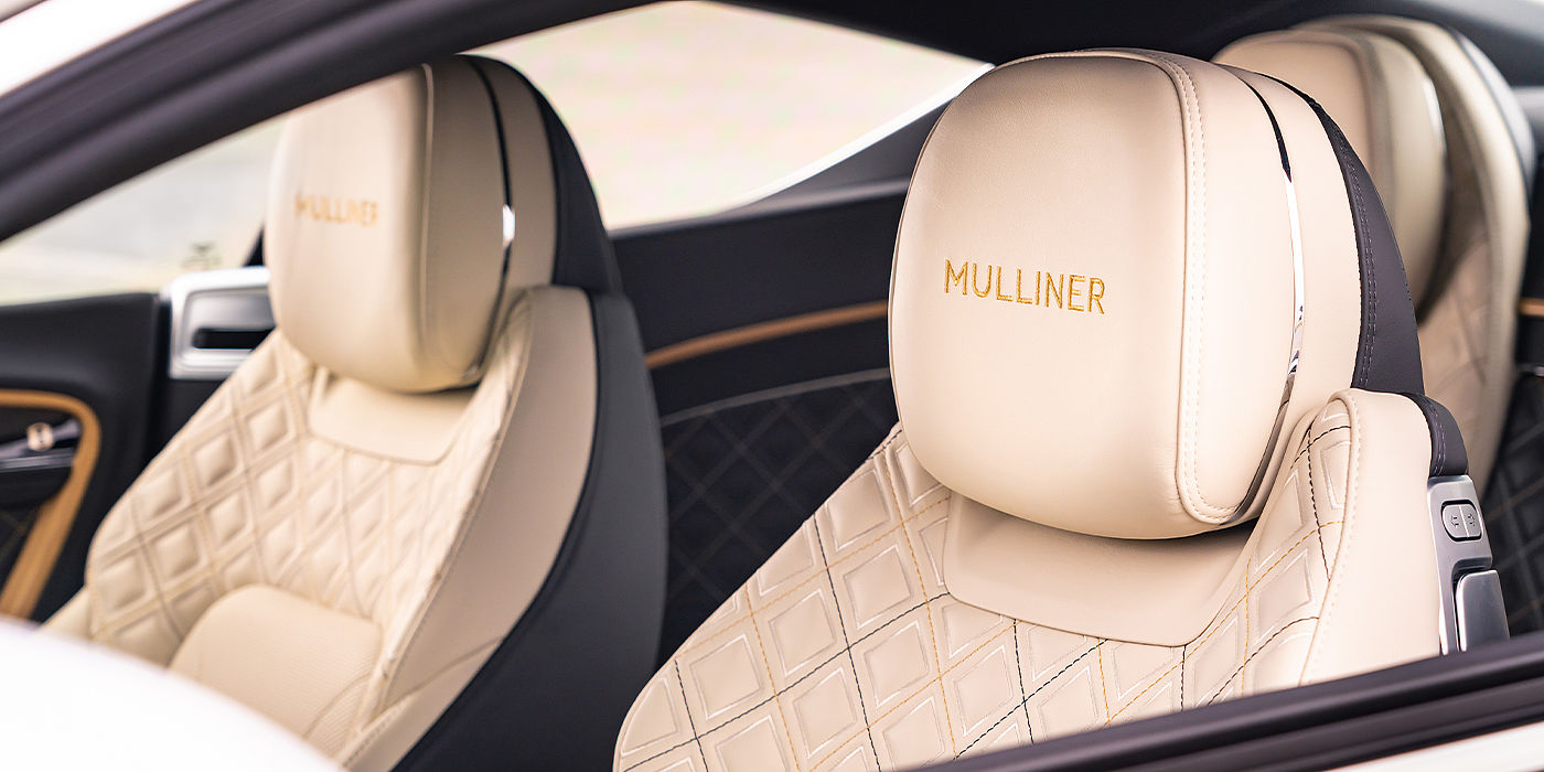 Gohm Sportwagen GmbH | Bentley Singen Bentley Continental GT Mulliner coupe seat detail in Beluga black and Linen hide