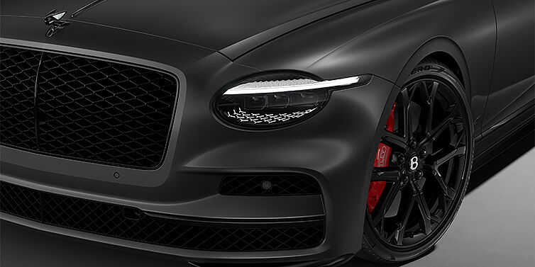 Gohm Sportwagen GmbH | Bentley Singen New Bentley Flying Spur S sedan head lamp against Anthracite Satin paint with 22" Sports wheel