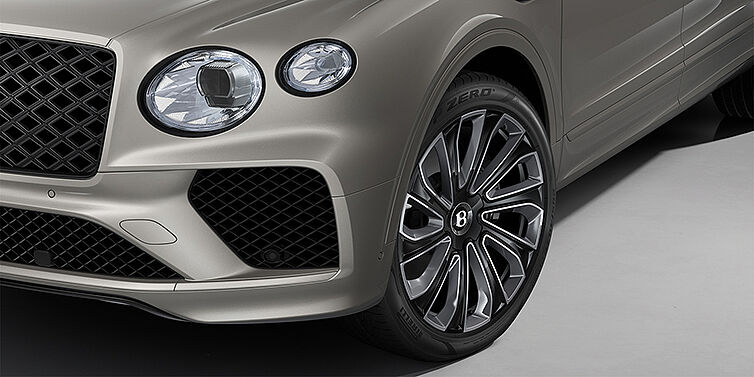 Gohm Sportwagen GmbH | Bentley Singen Bentayga EWB Artenara Edition SUV in Pale Brodgar paint with 22" Mulliner Gloss black wheel close up