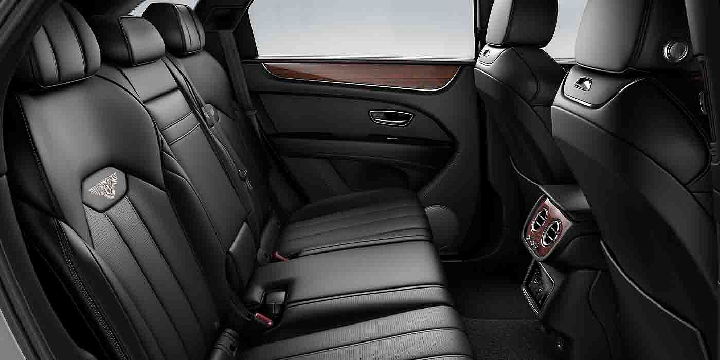 Gohm Sportwagen GmbH | Bentley Singen Bentley Bentayga EWB interior view for rear passengers with Beluga black hide.