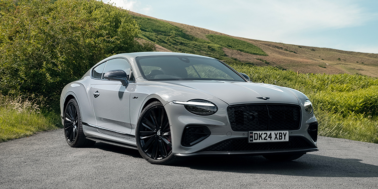 Gohm Sportwagen GmbH | Bentley Singen Bentley Continental GT front three quarter with Carbon Fibre Specification parked on road.