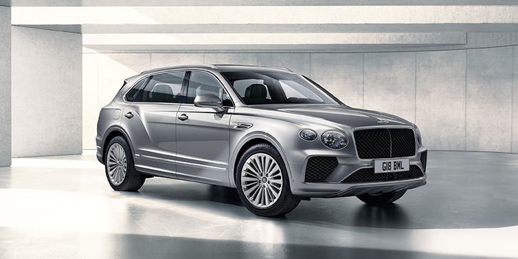 Gohm Sportwagen GmbH | Bentley Singen Bentley Bentayga Extended Wheelbase SUV front three quarter in Moonbeam paint with a grey background
