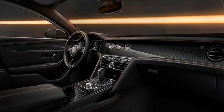 Gohm Sportwagen GmbH | Bentley Singen Bentley Flying Spur Black Edition sedan front interior in Beluga black hide with High Gloss Carbon Fibre veneer
