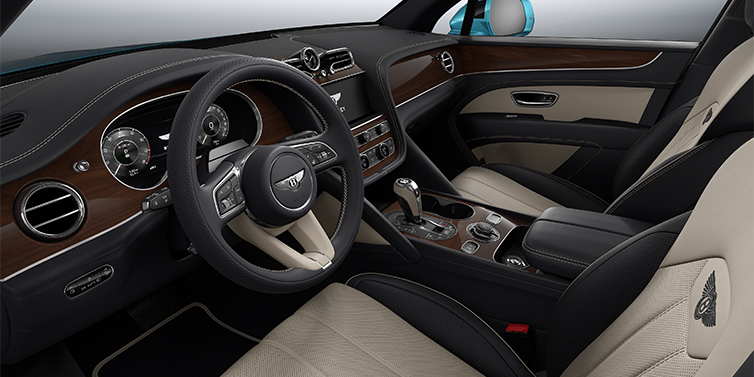Gohm Sportwagen GmbH | Bentley Singen Bentley Bentayga EWB SUV front interior in Portland and Imperial Blue hides with Crown Cut Walnut veneer