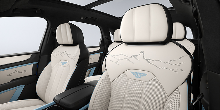 Gohm Sportwagen GmbH | Bentley Singen Bentley Bentayga Artenara Edition SUV front seats in Linen and Beluga Black hides with Light Blue accents and Artenara stitch detail