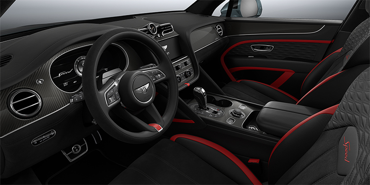 Gohm Sportwagen GmbH | Bentley Singen Bentley Bentayga Speed SUV front interior in Pillar Box Red and Beluga black hides with Carbon Fibre veneer
