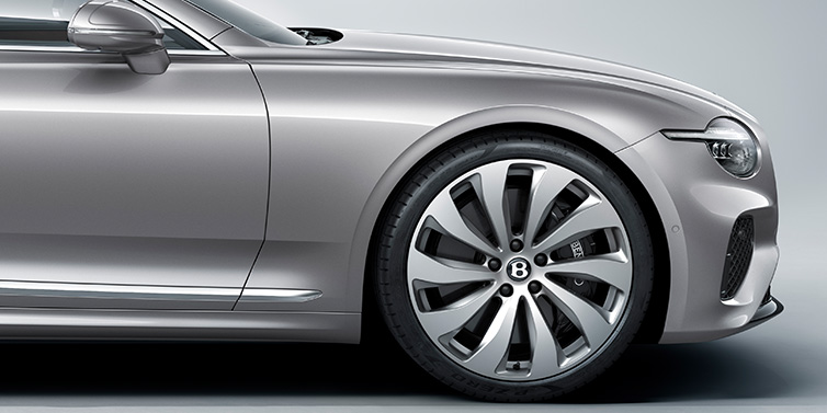 Gohm Sportwagen GmbH | Bentley Singen New Bentley Continental GT coupe side view featuring bonnet in Silverlake paint and 22 inch ten spoke silver painted and bright machined wheel