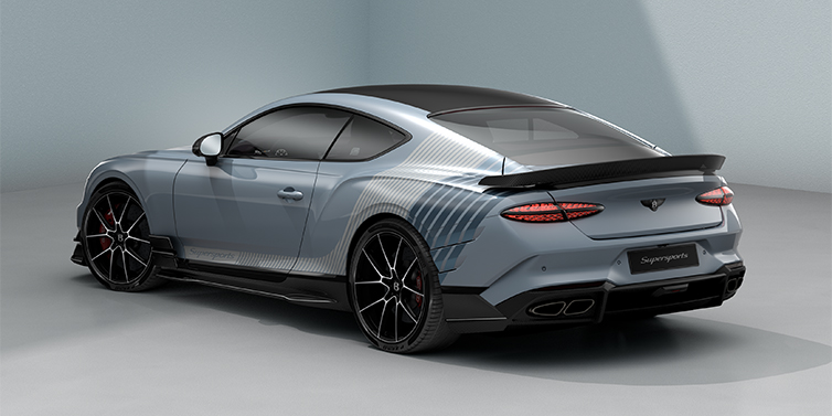 Gohm Sportwagen GmbH | Bentley Singen Bentley Supersports rear three quarter in "Daybreak" Design theme with Jetstream blue paint and Arctica white and Portofino blue paint stripes across the rear haunch.