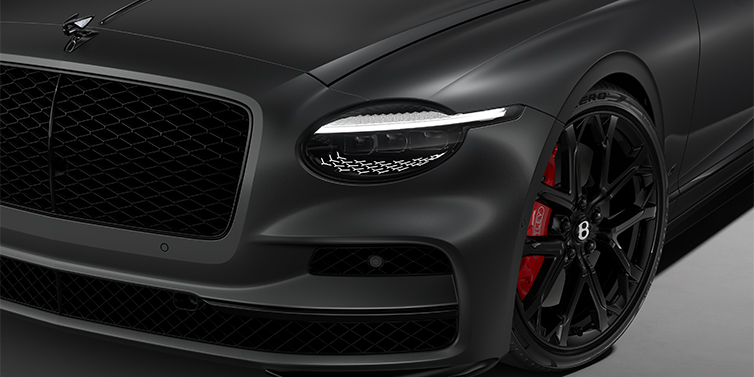Gohm Sportwagen GmbH | Bentley Singen New Bentley Flying Spur S sedan head lamp against Anthracite Satin paint with 22" Sports wheel