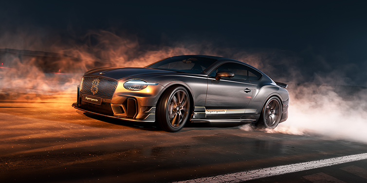 Gohm Sportwagen GmbH | Bentley Singen Bentley Supersports front three quarter in "Nightfall" Design theme with Anthracite paint, Camel accents and Camel and Beluga black striping standing on mist covered concrete