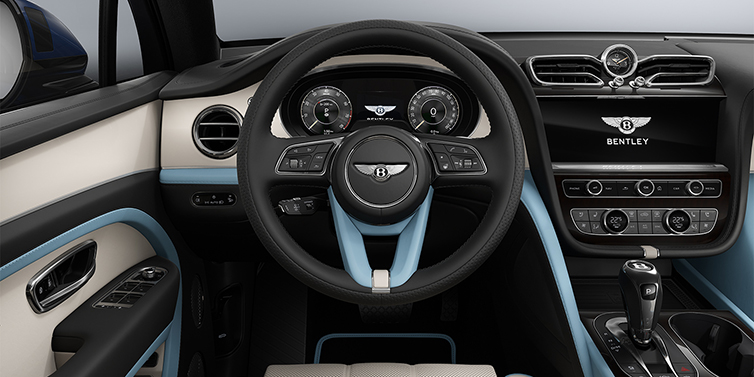 Gohm Sportwagen GmbH | Bentley Singen Bentley Bentayga Artenara Edition SUV steering wheel view in Linen and Beluga Black hides with Light Blue accents and Piano Linen veneer