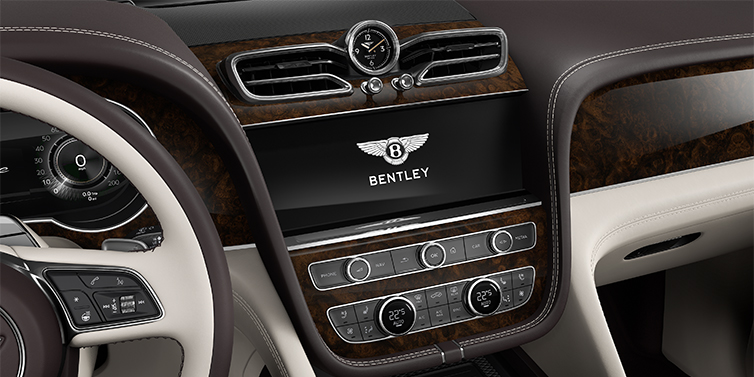Gohm Sportwagen GmbH | Bentley Singen Bentley Bentayga EWB Azure SUV centre console detail showing Bentley Wings