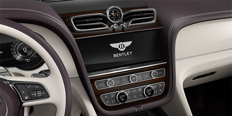 Gohm Sportwagen GmbH | Bentley Singen Bentley Bentayga Azure SUV centre console detail showing Bentley Wings